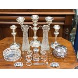 A pair of weighted silver candlesticks W J Myatt and Co, Birmingham 1910,