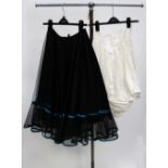 A stiff net black skirt,