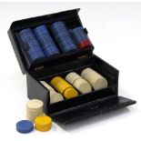 An Asprey box of Bakelite Poker chips contained within a navy blue Moroccan leather box,