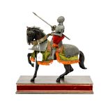 A Knight mounted on a cast metal horse,