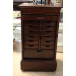 A mahogany tambour fronted cabinet, enclosing multiple drawers, 82cm high, 36cm wide,