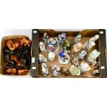 Box of mixed ceramic figurines and a box of carved wooden Elephants.