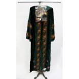 A 1960 embroidered velvet button through long (full length) coat;