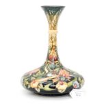 A Moorcroft squat bulbous vase with narrow neck, signed to base Rachel Bishop 2001,