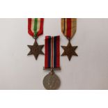 WW2 British Africa Star, Italy Star and British War Medal 1939-45. Complete with ribbons.