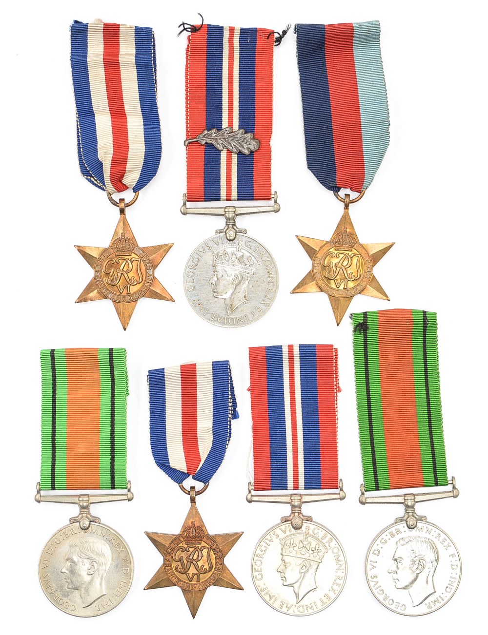 WW2 British Defence and War Medals in original packaging and box of issue, with 1939-1945,