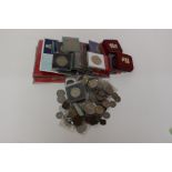 A collection of World coins includes cased sets and Crown sized coins