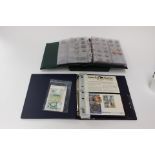 An album of coins containing £5 x 28 with an album of The Royal Family coin and stamp covers,