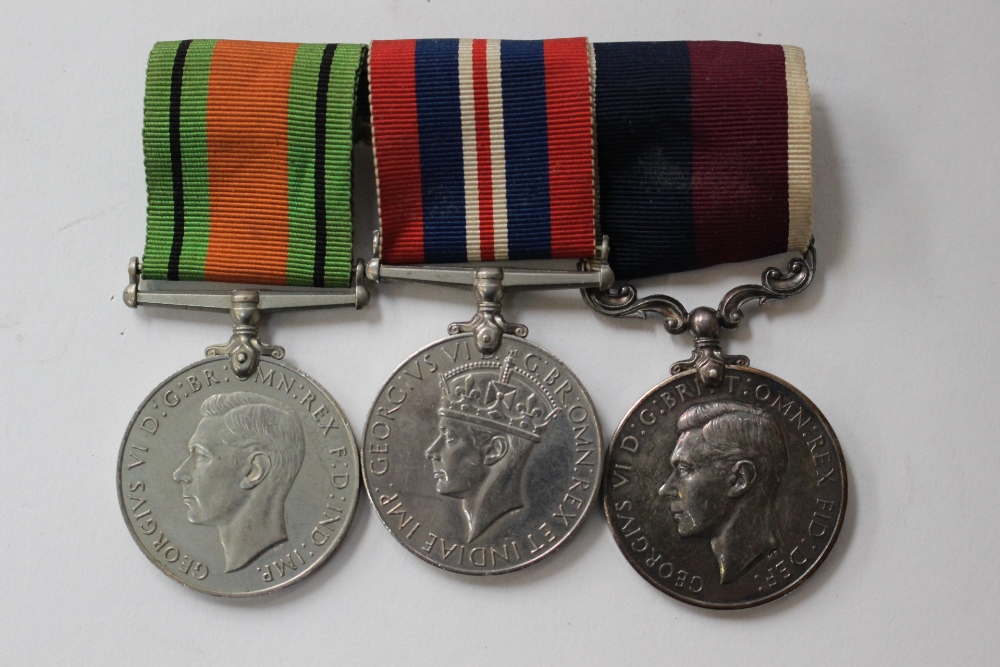 WW2 British Medal group mounted on a bar with original ribbons: Defence Medal,