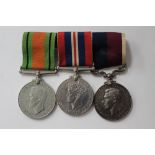 WW2 British Medal group mounted on a bar with original ribbons: Defence Medal,