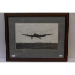 Framed original pencil drawing of a Lancaster bomber coming into land by artist Paul Holland.