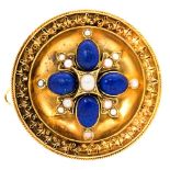 A Victorian Etruscan style circular shield brooch,