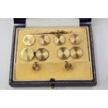 A Gents 9ct gold dress stud set comprising a pair of chain cufflinks,