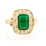 An emerald and diamond octagonal 18ct yellow gold cluster ring,