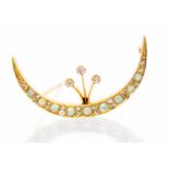 An Edwardian opal and diamond set yellow gold crescent brooch,