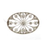 An Art Deco diamond set oval brooch, a total of eighteen round old brilliant cut diamonds,