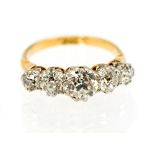 A five stone diamond 18ct yellow gold ring, claw set graduating old cut diamonds,