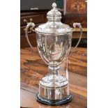 A large silver plated trophy cup,