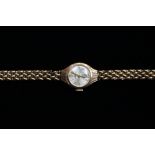 A 9ct. gold ladies wristwatch on chain strap, approx 12.