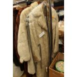 A shaded Musquash full length coat;