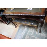 A George II style mahogany writing table, the top inset with a leather writing surface,