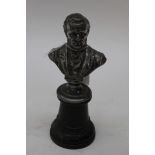 A WWF plated bust of Wagner sited on an ebonised column, 22 cm, 8.