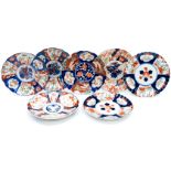 Seven similar sized Imari plates, a similar 'pair' one damaged, one has chip,