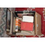 A box of various books including The Beatles, Gold Finger,