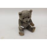 An early 20th Century mohair musical teddy bear,