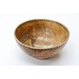 An unusual small Oriental bowl in white metal mounts, four character script mark to base,