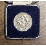 Football Medal: A silver 'Inter Platoon Football Competition' football medal embossed with a