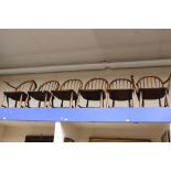 A set of six Ercol stick back chairs, with elm seats,