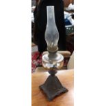 A cast iron based 19th Century oil lamp