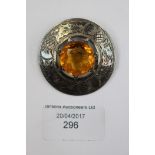 Scottish Interest - a silver brooch set with yellow stone