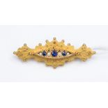 An 1875 Birmingham 9ct gold brooch set with seed pearls and three sapphires