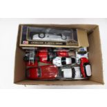 Three boxes of play worn die cast model cars: to include one box of large scale sports cars,