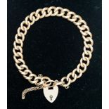 A 15ct gold link bracelet with locket clasp, 28.