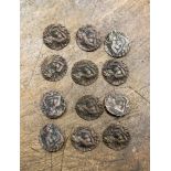 A set of twelve Art Nouveau design silver buttons of a Goddess playing a lyre,