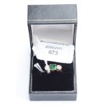 An emerald and diamond three stone 18ct gold ring,