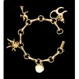 A 9ct gold charm bracelet containing four assorted 9ct gold charms approx 56.