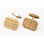 A pair of 9ct gold cufflinks with rectangular shaped terminals and bright cut engraved,