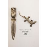 A silver Owl bookmark;