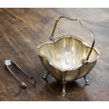 A Sheffield silver sugar bowl, Sheffield 1906, maker John Round, with sugar nips, Sheffield 1911,