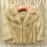 A short bolero Mink jacket in natural off white and silver grey tones, size approx 10/12,
