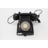 A black vintage telephone