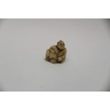 Japanesse Netsuke of a seated male,