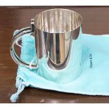 A Tiffany silver plated mug with geometric double handle, stamped Tiffany to base,