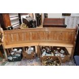 A Victorian pitch pine pew of curved form,