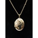 A 9ct yellow gold oval locket and chain, 9.