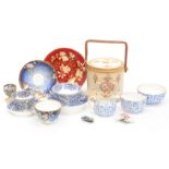 A 19th century Staffordshire cup and saucer, a Crown Devon biscuit barrel, Minton cups and saucer,